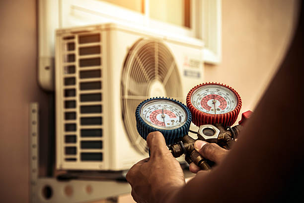 Professional Air Conditioning Service technician working in Danville, AR